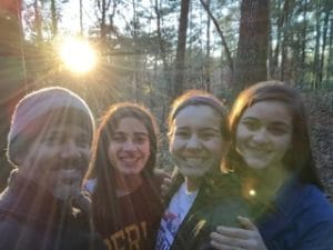 Fernando and his beautiful bicultural, bilingual teen daughters at sunrise camping